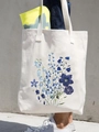 White canvas tote bag featuring vibrant blue floral watercolor print and green leaves - Blue Floral