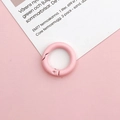 Detailed close-up of a 20mm pink painted round spring snap ring for DIY jewelry making - Light Pink