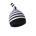 Close-up of soft black and white striped newborn hat with a top knot design and smooth fabric - Black & White Stripes