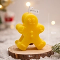 Gingerbread man scented candle in bright yellow for Christmas festive atmosphere - Yellow Gingerbread Man