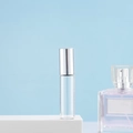 Detailed view of an empty 10ml glass roller bottle with a silver metal cap on white stand - 5ml Silver