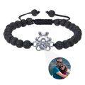 Detail of black lava stone bracelet featuring a silver paw pendant with photo projection lens - Lava Stone (Customized)