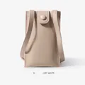 Minimalist off-white mini crossbody phone bag with a textured leather finish and slim strap - Off White