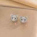 Macro detail of silver bear earrings with sparkling clear cubic zirconia and black zircon eyes - Little Bear Studs / Steel