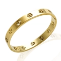 Gold zodiac sign bangle in titanium steel featuring intricate hollow constellation carvings - Hollow Zodiac Sign / Gold