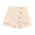 Elegante beige asymmetrische skort voor dames met decoratieve metalen knopen aan de zijkant - XS / Melkwit