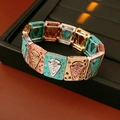Detail of vintage bohemian elastic bracelet featuring turquoise blue and metallic modules - Multicolor Splicing Arrow Embossed Style