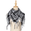 Detailed view of black and white houndstooth Shemagh scarf on a wooden neck mannequin - White