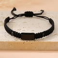 Detail of adjustable woven cord bracelet with black stainless steel plaque and bead accents - Black (Black Plate)