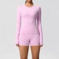Close-up of pink long-sleeved sports top and high-waisted shorts with soft brushed fabric - Sakura Pink
