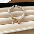 Bracelet en perles charmant avec pendentif pêche rose et finitions dorées à l'or - Pêche