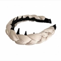 Detail of cream satin braided headband featuring internal black plastic anti-slip teeth - Off White