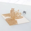 Detail of laser-cut glitter wedding invitation with Marry Me 3D pop-up couple silhouette - Glitter Rose Gold