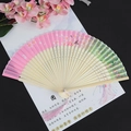 Pink and green gradient folding fan with cherry blossom pattern and pink silk tassel - White Cherry Pink Green Light Handle