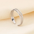 Detail of silver double-layer ring featuring smooth and twisted textures on silk - Double Layer Twisted Style (KR105046-KFC) - Steel Color