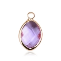 Macro shot of purple marquise-cut glass pendant with a gold metal frame and top loop - Gold - June