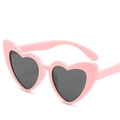 Pink heart-shaped sunglasses for girls with dark UV protection lenses on white background - Pink Frame Grey Lens