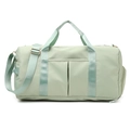 Light green fitness bag with double handles and adjustable shoulder strap in studio shot - Thickened Fruit Green