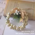 Détail d'une couronne de Noël de 14cm avec baies blanches et nœud en toile de jute - 21# Couronne de Cloches Blanc Cassé (14cm)