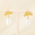 Close-up of French vintage bow-knot pearl earrings on a pink elegant jewelry stand - Gold Rope Knot (KE115927-GC)