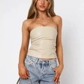Detail of apricot PU leather tube top showing the matte texture and strapless design - S / Tops / Ivory