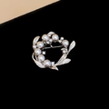 Detailed view of vintage silver brooch with grey pearls and sparkling rhinestones - Silver Grey Pearl Wreath