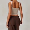 Slim fit women's beige yoga vest top shown from the back view in a studio setting - S / Light Khaki