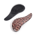 Leopard print and solid black detangling hairbrushes for wet and dry hair care - Brown