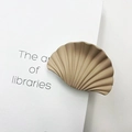 Elegant beige fan-shaped marble texture hair clip shown on a minimalist book cover background - Matte Rubber Khaki