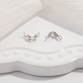 Macro shot of S925 sterling silver double-ear clasp connectors for DIY jewelry making - Large (3.8mm) / White Gold