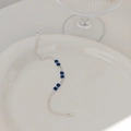 Silver bracelet featuring rectangular blue gemstones and round white zircon accents - Double Row Blue