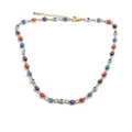 Détail du collier doré avec perles œil-de-bœuf en émail rouge, bleu et blanc et fermoir réglable - Collier Multicolore