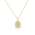 Macro shot of gold-plated rectangular pendant with micro-paved zircons featuring letter X - Necklace X