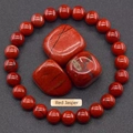 Natural Red Jasper beaded bracelet and raw stones set on dark textured background - Red Jasper