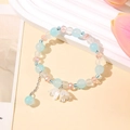 Elegant beaded bracelet with blue sea salt pearls, lily of the valley charms and metal chain - S044 - Blue Gradient Lily Of The Valley Bracelet #sz314