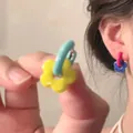 Detail of colorful enamel flower hoop earrings in bright yellow and royal blue colors - 23# Ear Buckle - Blue - Yellow - Pink
