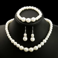 Elegant white pearl jewelry set with necklace bracelet and earrings on black mannequin - White Pearl Jewelry 3-Piece Set