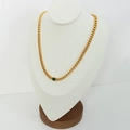 Golden Cuban chain necklace featuring a round green gemstone pendant on a mannequin - Gold Round Zirconia Necklace