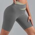 High-waisted dark grey yoga shorts with light green crossover waistband for women - S / Bottoms / Sea Rock Grey