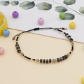 Handgewebtes Armband mit grauen Imperial-Steinperlen und goldenen Metallakzenten - BR0602 / Schwarz/Grau