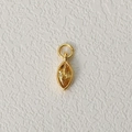 Golden pendant with marquise-cut yellow zircon birthstone on a white textured background - November-Yellow