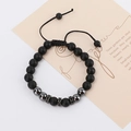 Detail of luxury men's bracelet with matte black beads and rhinestone crown charms - Adjustable Black Agate And Hematite