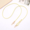 Close-up of yellow PU leather strap with golden lobster clasps and adjustable slider - Light Yellow