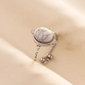 Macro detail of silver adjustable ring with oval white turquoise on beige silk fabric - Adjustable Open / Silver-White