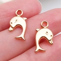 Two golden dolphin charms in KC gold alloy for DIY jewelry making and bracelets - Dolphin Pendant 17x9mm