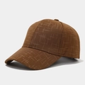 Macro detail of caramel brown fabric texture and side profile of the baseball cap - Coffee