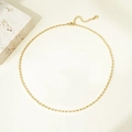 Detailed close-up of golden oval bead necklace with adjustable chain and brand tag - Gold Necklace#2.5mm Medium