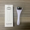Mini face and eye massage roller with white handle and silver metal head in packaging - YQ033A White Handle / White