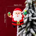 Christmas Santa Claus cake topper holding gift box and tree, height 4.9cm and width 5cm - Soft Rubber Santa Holding Gift and Tree