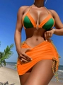 Detail of color-block bikini with woven drawstring skirt on a sunny beach background - S / Orange